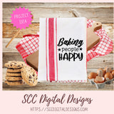 Kitchen towel with 'Baking people Happy' text on a wooden surface with cookies and eggs.