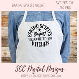 Apron with 'Baking Spirits Bright! Welcome to my Kitchen' text on a wooden background, featuring the brand 'SCC Digital Designs'.