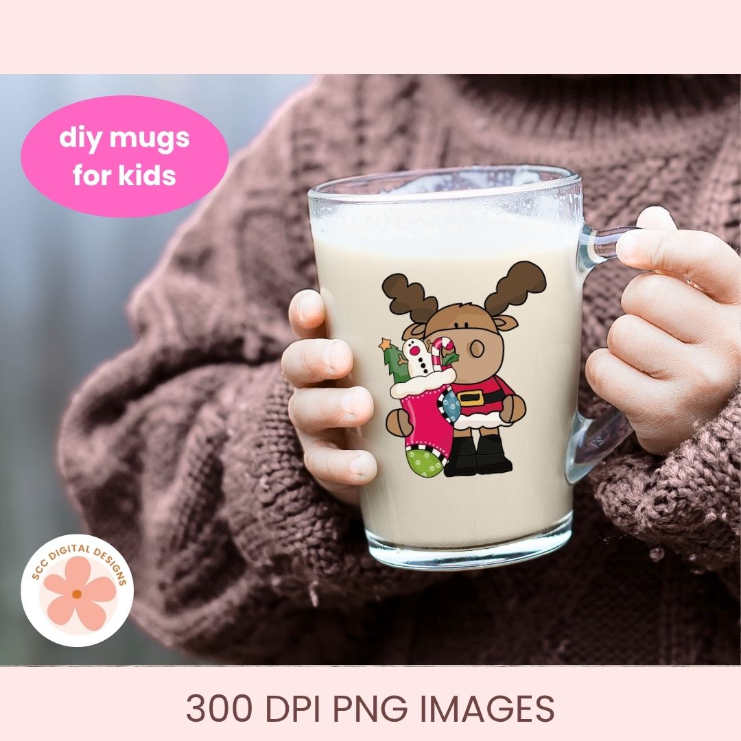 A person in a brown knit sweater holds a clear glass mug filled with a light beige drink. The mug has a cartoon reindeer graphic wearing a red Santa hat and holding a green tree.