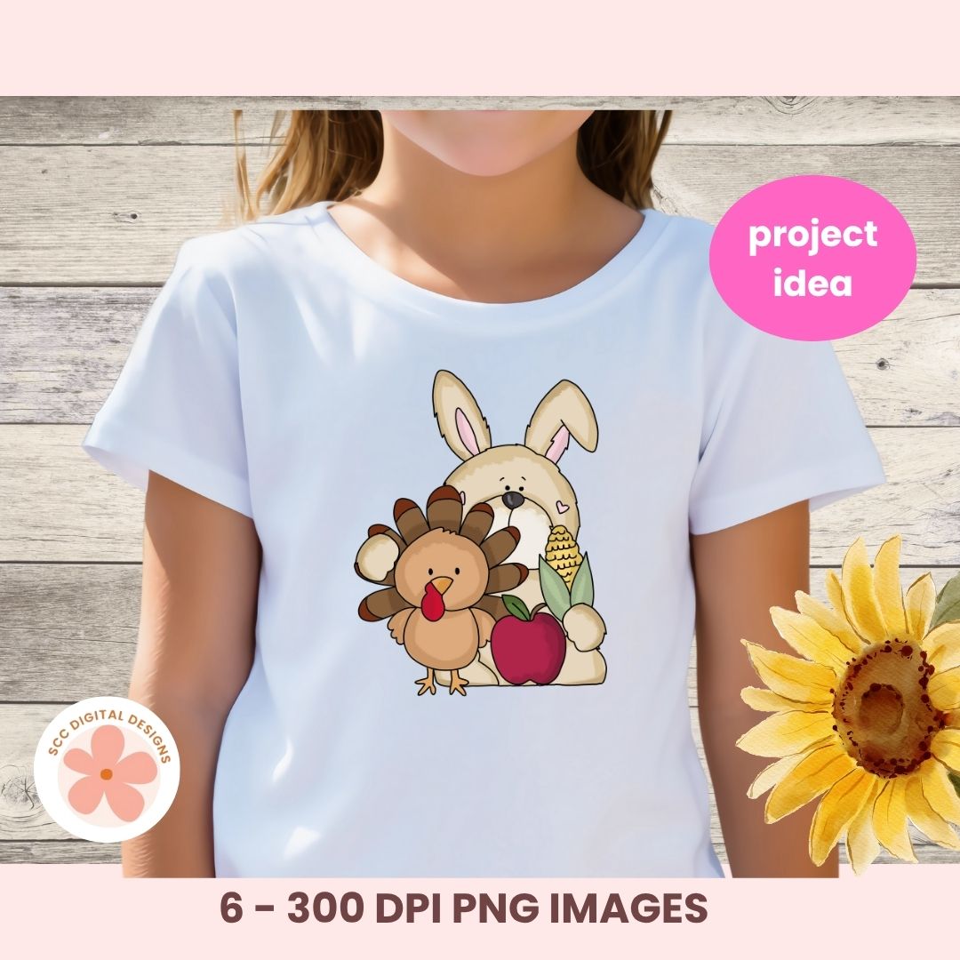 A child wearing a white short-sleeve T-shirt with a cartoon Thanksgiving-themed bunny and turkey graphic on the front, shown against a rustic wood background with a pink 'project idea' badge and a sunflower decoration.