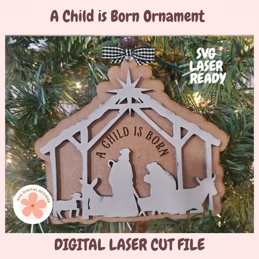 Decorative Christmas ornament with nativity scene on a tree, featuring text 'A Child is Born'.