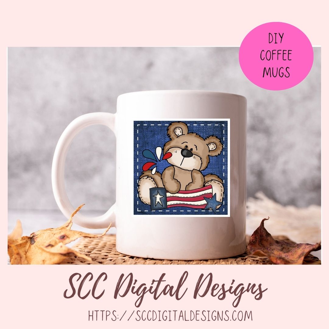 White mug with teddy bear design featuring an American flag, on a textured surface with 'SCC Digital Designs' branding.