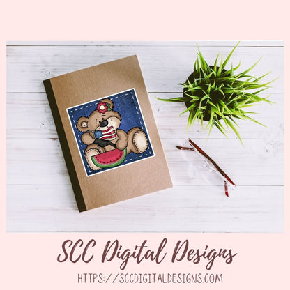 Notebook with teddy bear design on a wooden surface with a plant and pen.