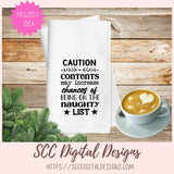 Towel with humorous text on a wooden surface with a cup of coffee and Christmas decorations.