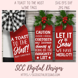 Three red wine tags with Christmas-themed text on a wooden background, featuring the brand 'SCC Digital Designs'.
