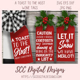 Three red wine tags with Christmas-themed text on a wooden background, featuring the brand 'SCC Digital Designs'.