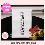 White towel with 'Wishing you a very merry Christmas' text on a rack, with gold bells and red ribbons.