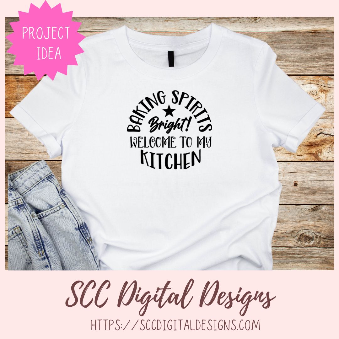 White t-shirt with black text on a wooden surface, featuring 'SCC Digital Designs' branding.