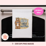 White towel with bear graphic and 'Bear without coffee' text hanging on a stove handle, with 'project idea' label.