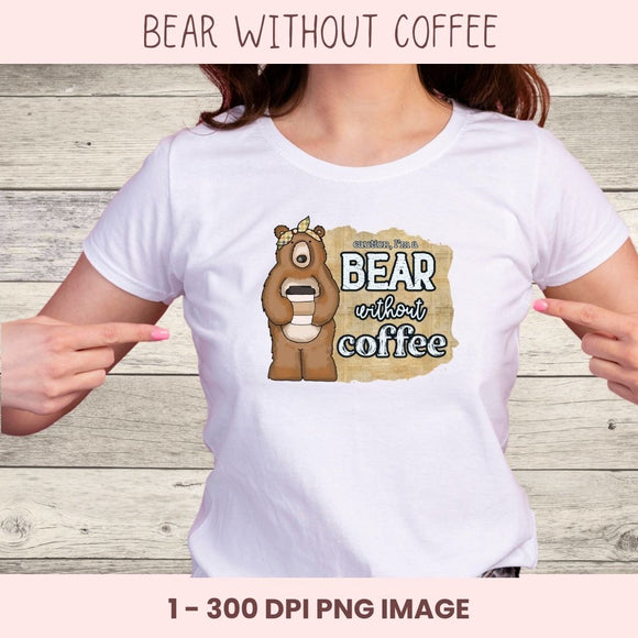 White t-shirt with a bear graphic and text 'Bear without coffee' on a wooden background