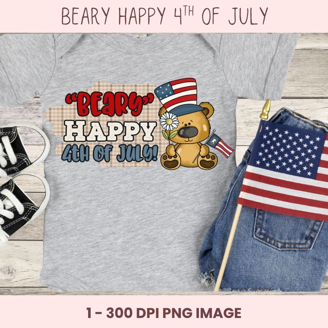 Gray t-shirt with a bear graphic and text 'BEARY HAPPY 4TH OF JULY' on a wooden surface with an American flag.