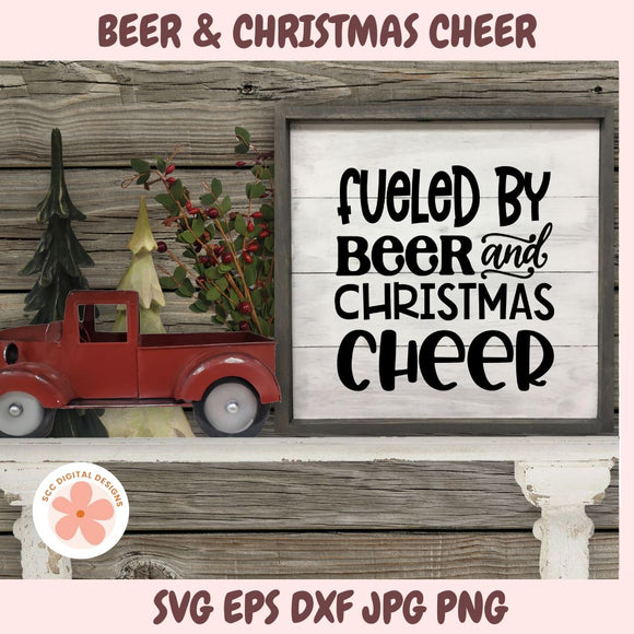 Decorative sign with 'Fueled by Beer and Christmas Cheer' text, red truck, and Christmas tree on a wooden background.