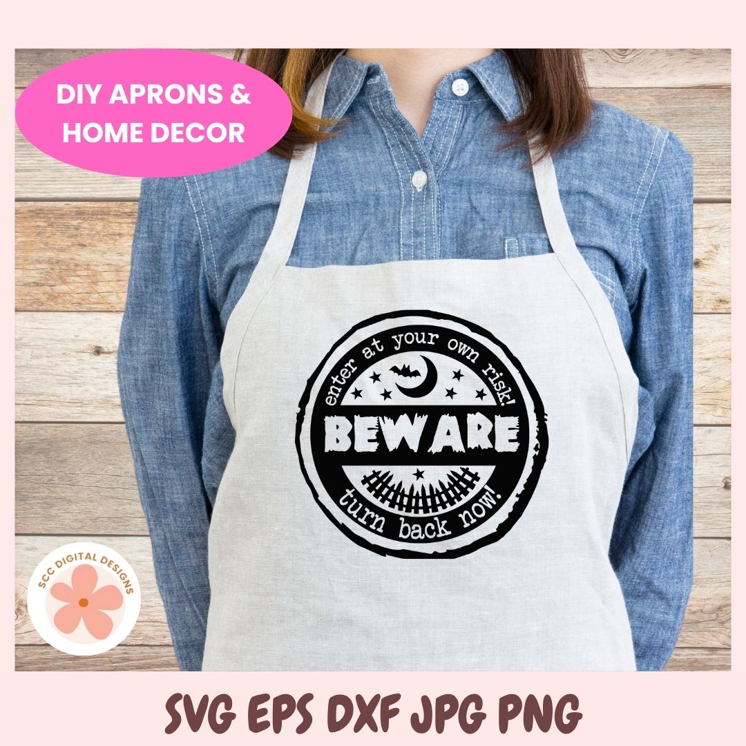 Person wearing a white apron with a black graphic design on a wooden background