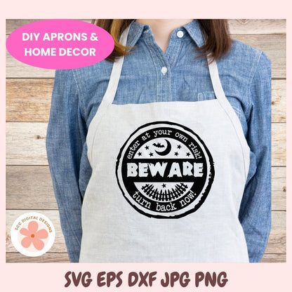 Person wearing a white apron with a black graphic design on a wooden background