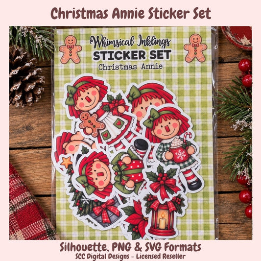 Christmas Annie sticker set in a clear plastic sleeve, featuring illustrated characters and holiday motifs on a green plaid background. The package is displayed on a rustic wooden surface with pine branches, a pinecone, and red berries, with text reading 'Christmas Annie Sticker Set' and 'Silhouette, PNG & SVG Formats' at the top and bottom.