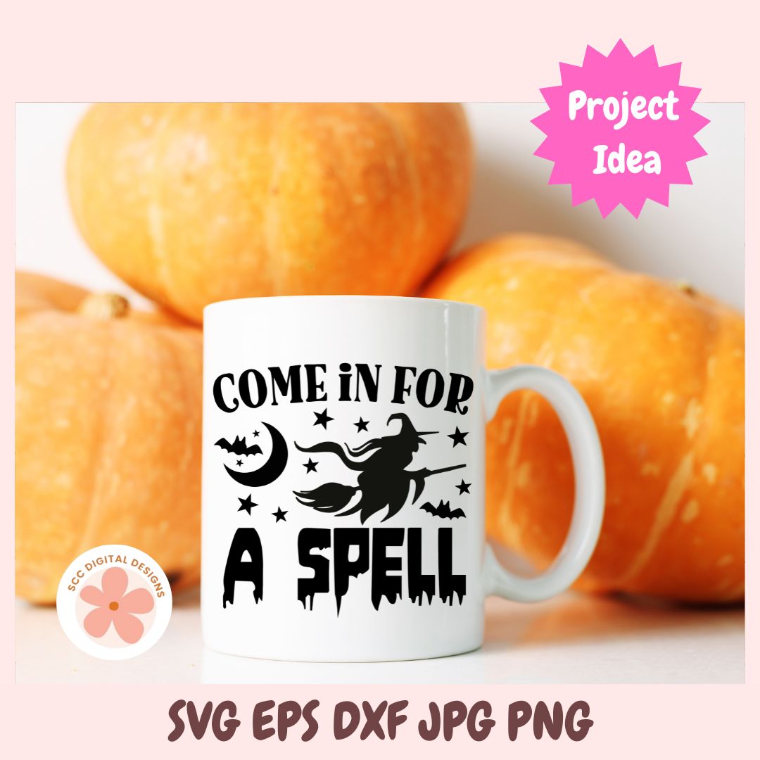 White mug with 'Come in for a spell' design in front of pumpkins, with 'Project Idea' text and 'ecocolors designs' logo.
