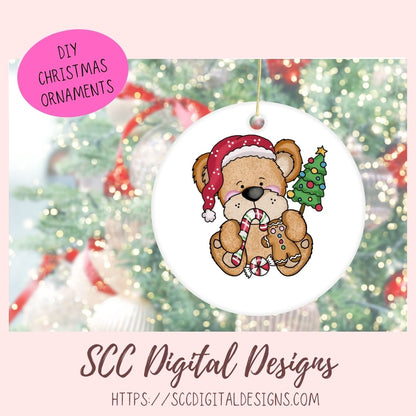 Circular Christmas ornament with a teddy bear holding a gingerbread man, surrounded by festive decorations, with 'SCC Digital Designs' branding.