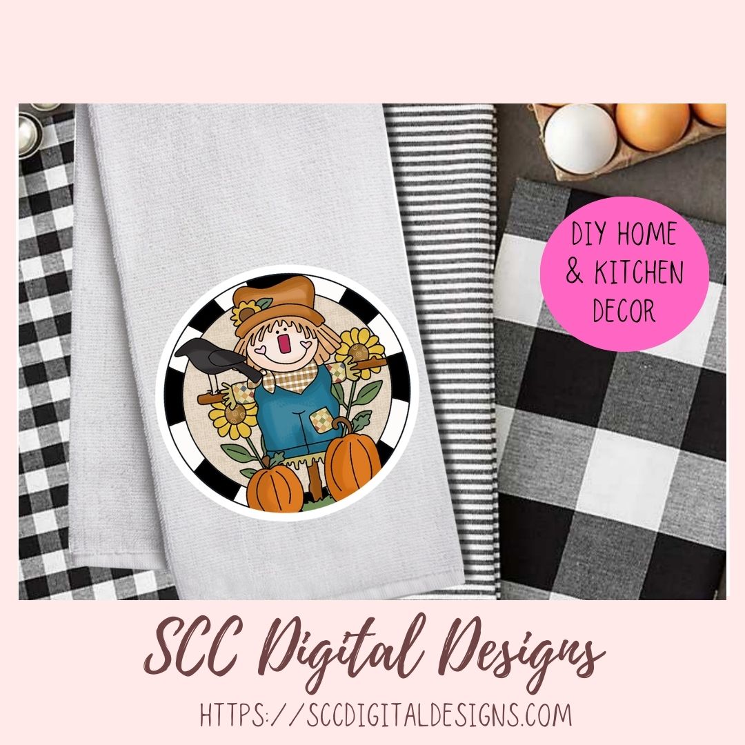 A styled product mockup showing a circular autumn scarecrow design printed on a light gray fabric item, alongside black-and-white buffalo plaid and striped fabrics, eggs, and a pink badge reading DIY HOME & KITCHEN DECOR. Text at the bottom says SCC Digital Designs with a website.