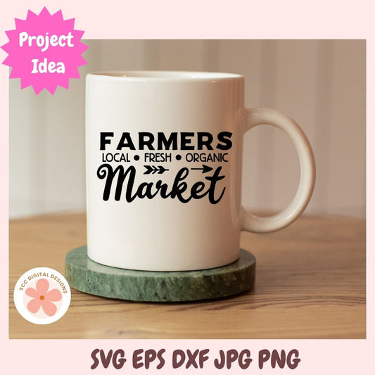 White mug with 'Farmers Market' text on a wooden surface, with a pink overlay and branding logo.