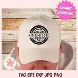Beige cap with a black circular design on a wooden background