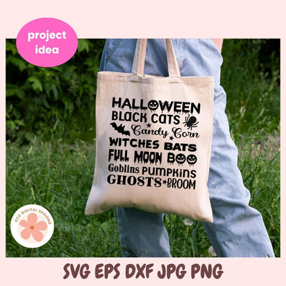 A beige canvas tote bag with black Halloween-themed text and graphics, held by a person wearing blue jeans in a grassy outdoor setting. The image includes a pink border with 'project idea' and 'SVG EPS DXF JPG PNG' text, plus a circular 'eco digital designs' logo.