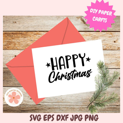 White card with 'Happy Christmas' text, red envelope, and pine branch on wooden surface with 'DIY Paper Crafts' label.