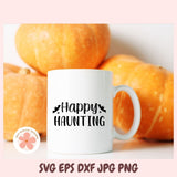 White mug with 'Happy Haunting' text in front of pumpkins, with a pink background and 'ecocollective designs' logo.