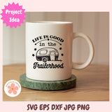 White mug with 'Life is good in the trailerhood' design on a wooden surface, with a pink 'Project Idea' label.