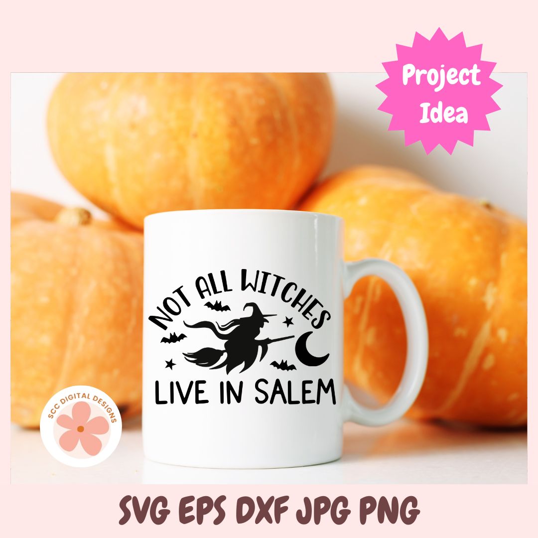White mug with 'Not all witches live in Salem' design in front of pumpkins, with 'Project Idea' label.