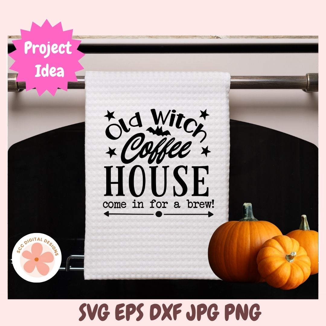 White towel with 'Old Witch Coffee House' text on a rack with pumpkins.
