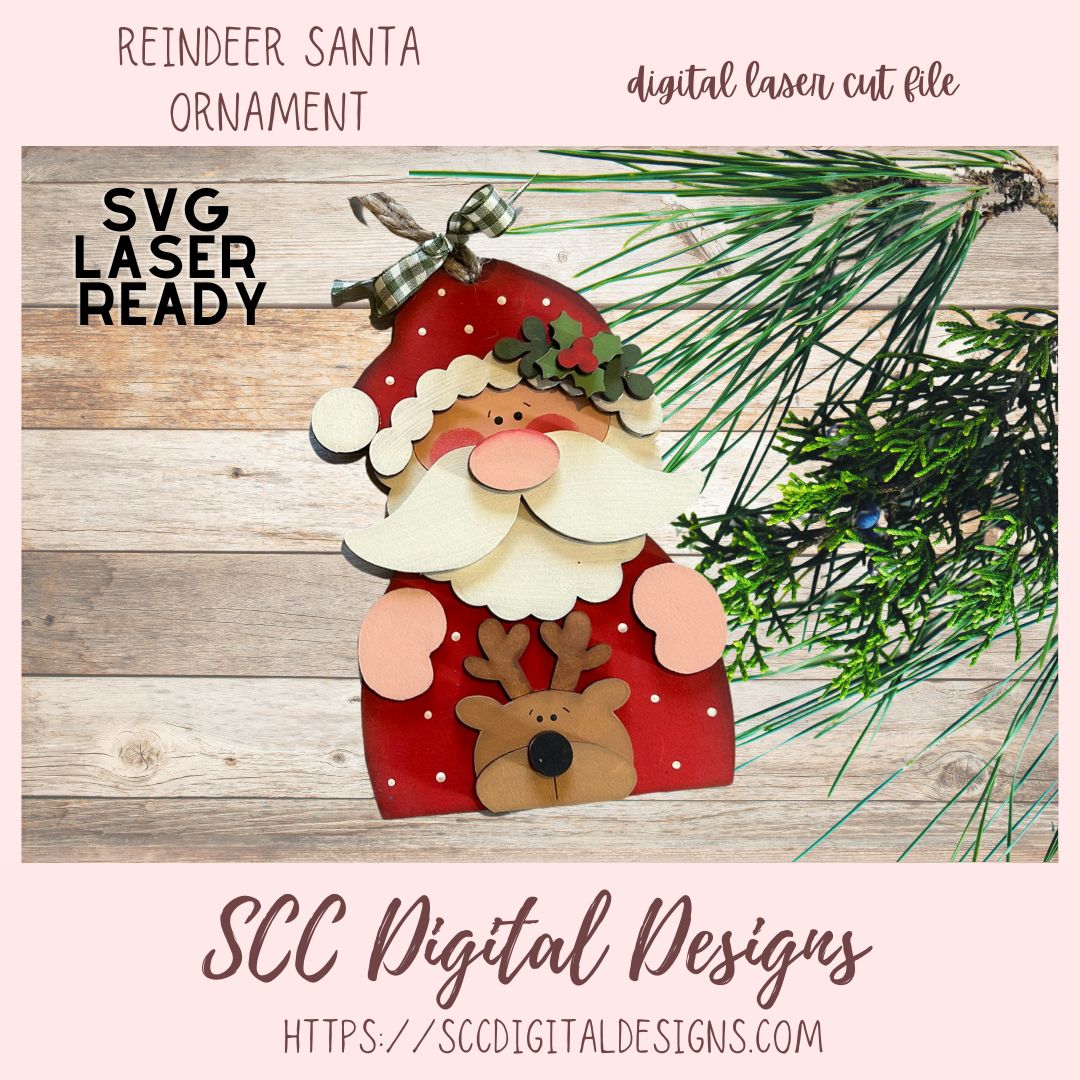 Digital laser cut file of a reindeer Santa ornament with greenery on a wooden surface, featuring 'SVG Laser Ready' text.