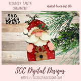 Digital laser cut file of a reindeer Santa ornament with greenery on a wooden surface, featuring 'SVG Laser Ready' text.