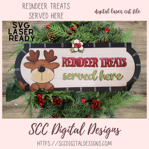 Decorative sign with reindeer design and text 'Reindeer treats served here' surrounded by Christmas decorations.