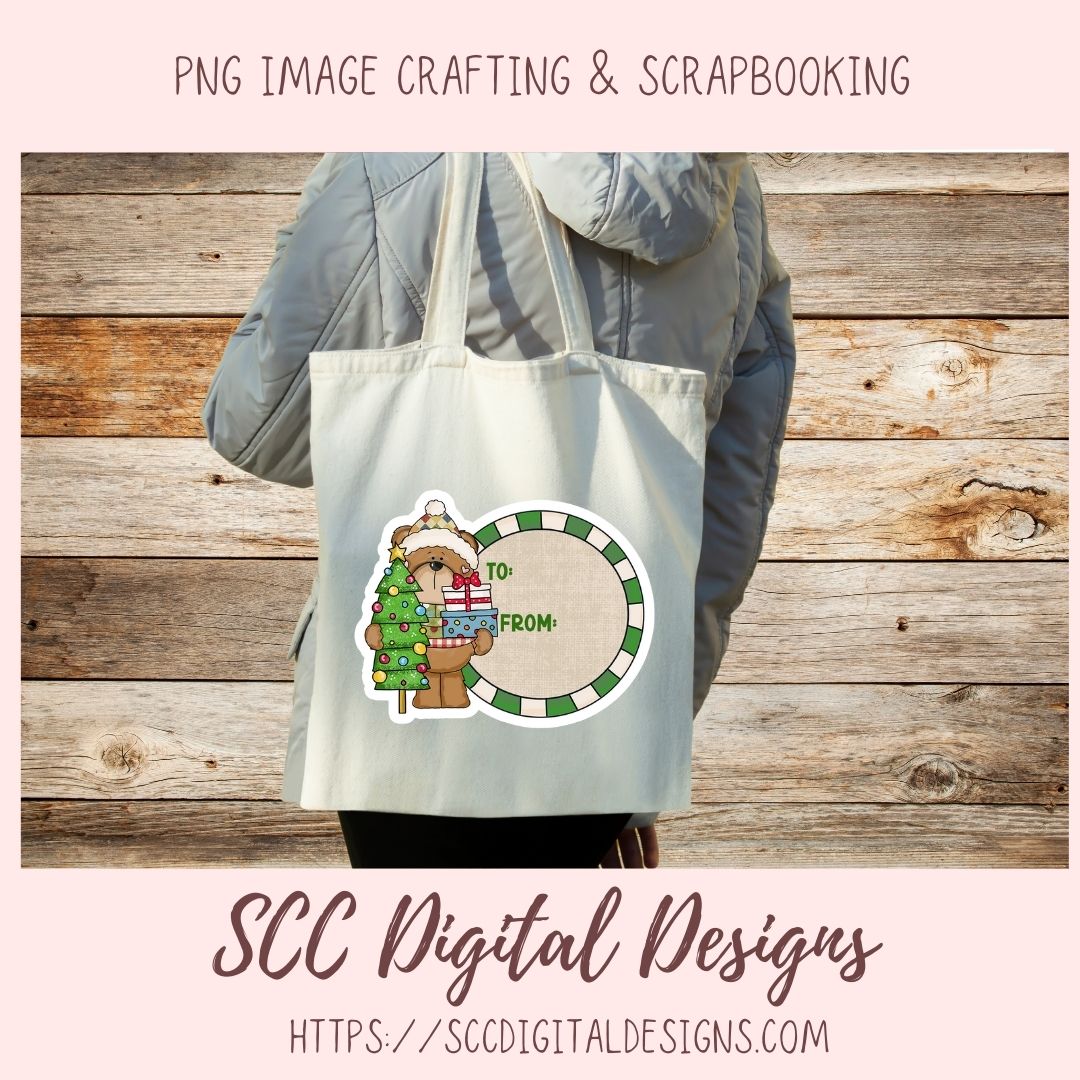 A person wearing a gray puffer jacket carries a white canvas tote bag with a Christmas-themed graphic design. The design features a teddy bear holding a green Christmas tree and gift, next to a circular label that reads 'TO' and 'FROM'.