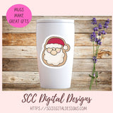 White tumbler with Santa Claus design on a wooden background with lavender.