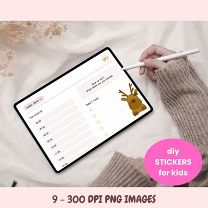 Person using a stylus on a tablet with a reindeer sticker, on a soft fabric background.
