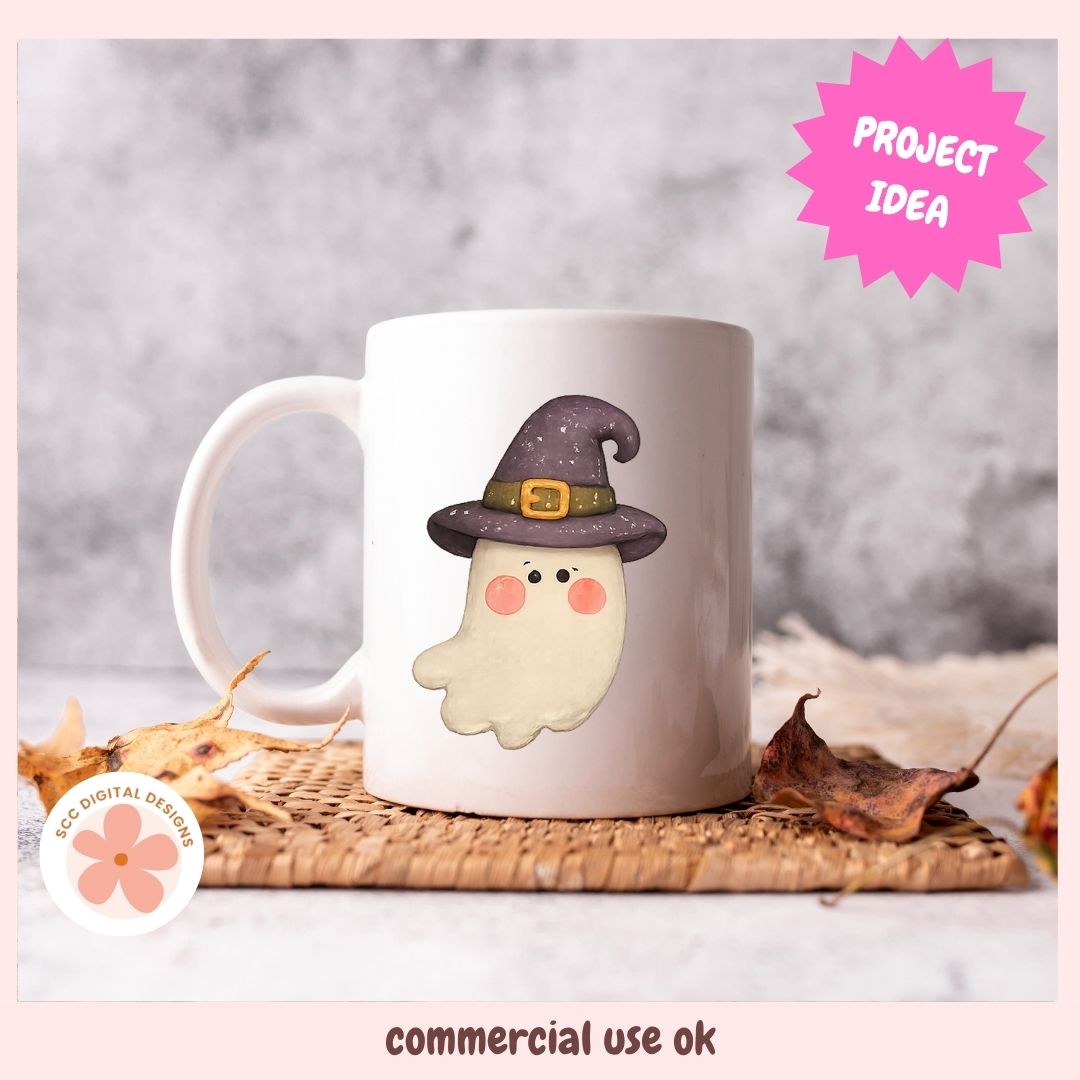 A white ceramic mug featuring a cute cartoon ghost wearing a purple witch hat, styled on a woven placemat with dried autumn leaves against a gray background. Includes 'PROJECT IDEA' and 'commercial use ok' text overlays.