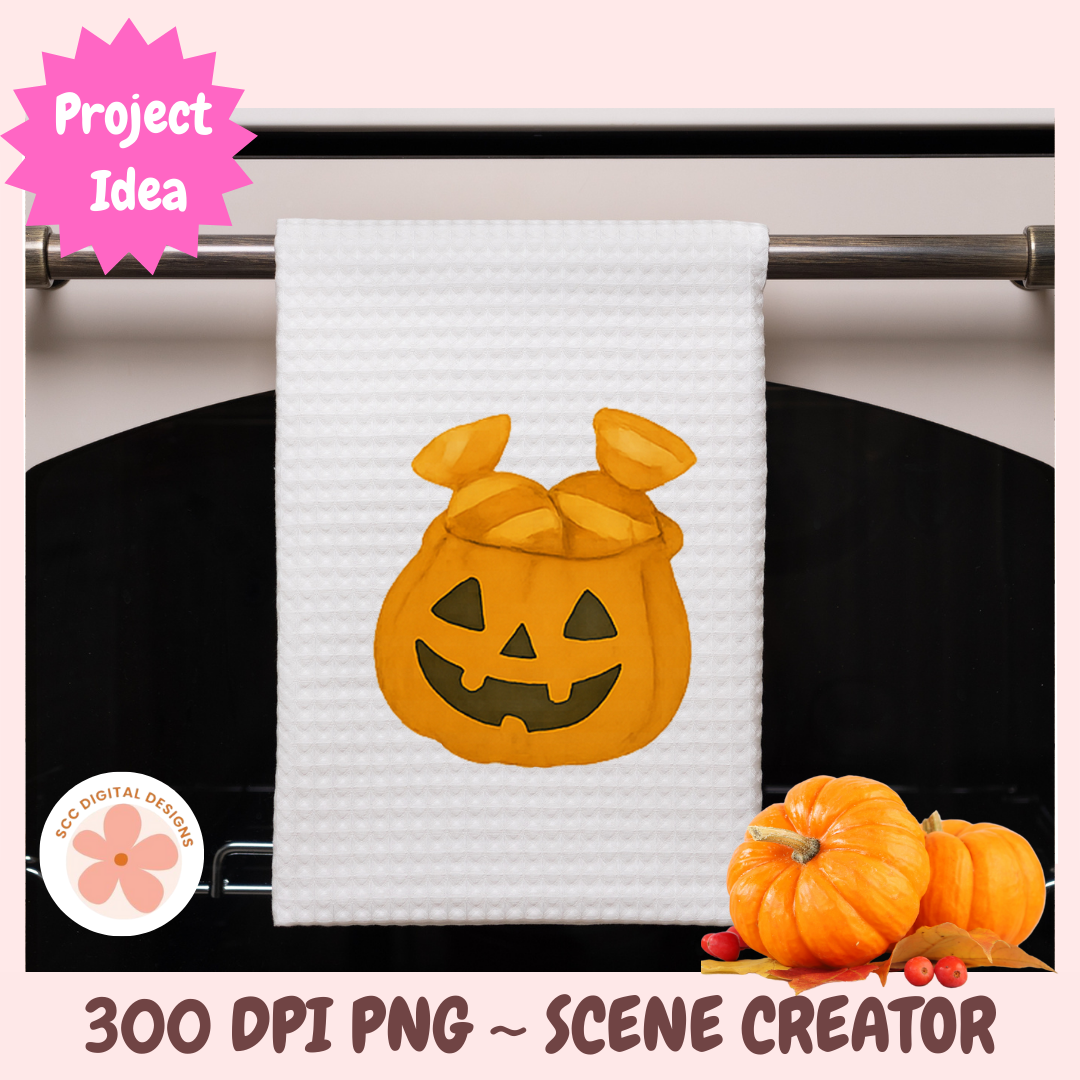 White towel with pumpkin design hanging on a rack, surrounded by small pumpkins.