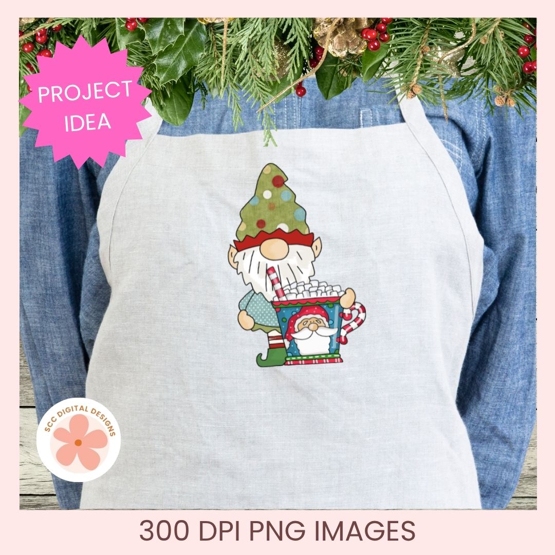 A white apron with a Christmas gnome holding a popcorn bucket graphic, shown over a blue denim shirt with pine garland at the top. Pink text badges read 'PROJECT IDEA' and '300 DPI PNG IMAGES'.