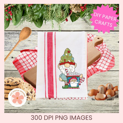 A festive kitchen towel with a Christmas gnome and tree design, styled on a rustic wood background with cookies, eggs, a wooden spoon, and holiday greenery. Text overlays read 'DIY PAPER CRAFTS' and '300 DPI PNG IMAGES'.