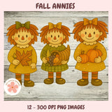 Three cartoon girls with autumn-themed items on a wooden background, labeled 'Fall Annies'.