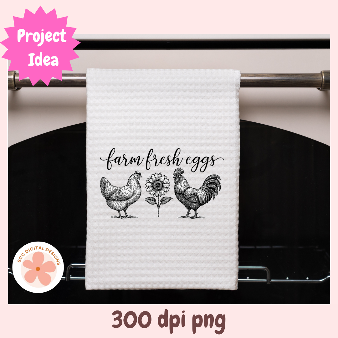 White towel with rooster, hen, and sunflower design hanging on a stove handle.