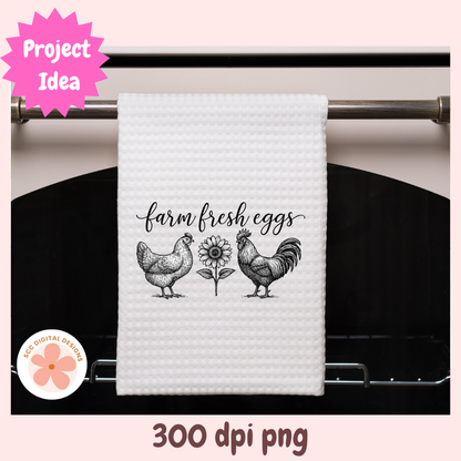 White towel with rooster, hen, and sunflower design hanging on a stove handle.
