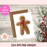 Gingerbread man card with envelope on a wooden surface with Christmas decorations.