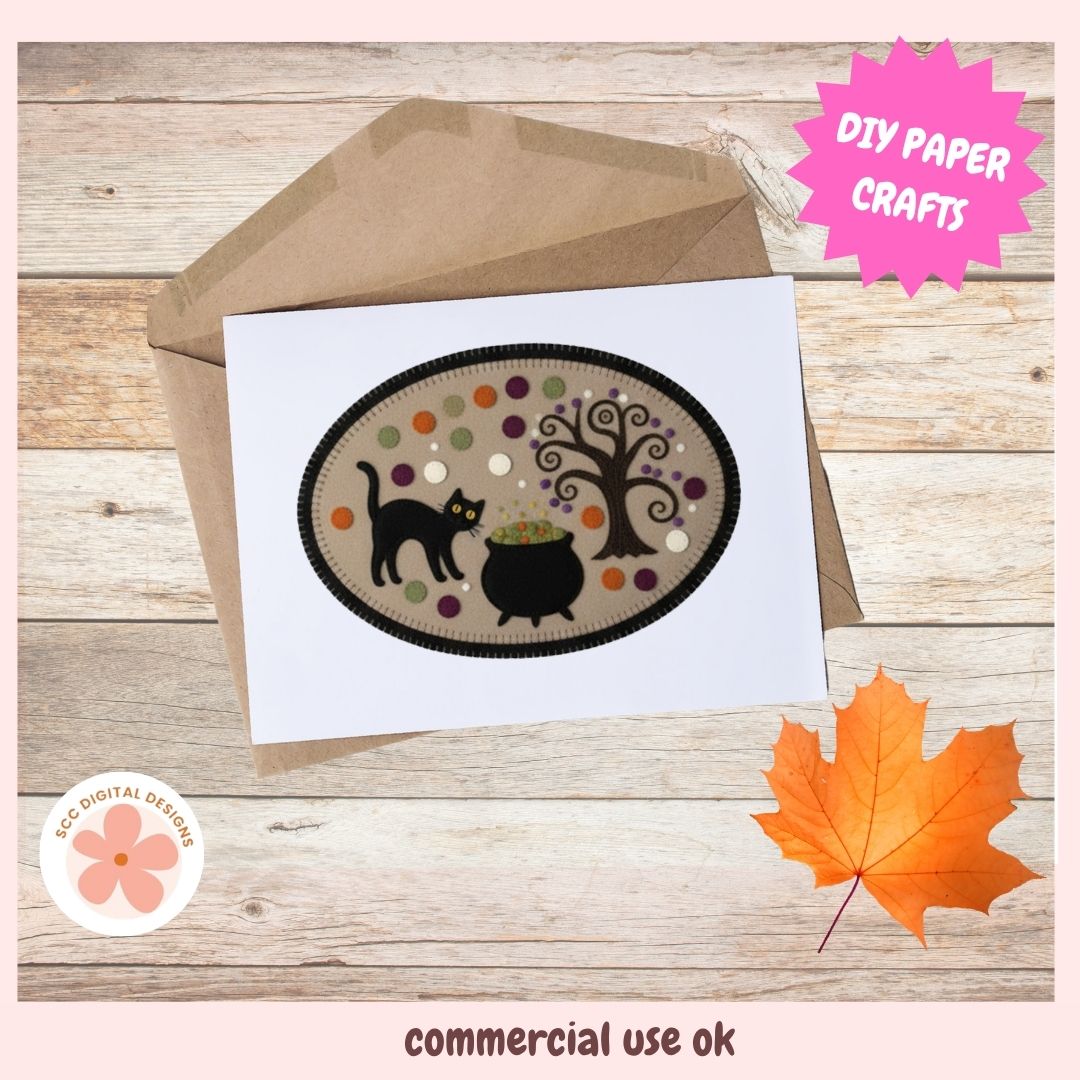 A white greeting card with a Halloween-themed oval illustration, shown partially tucked into a brown kraft envelope on a light wood surface. The card design features a black cat, cauldron, tree, and colorful dots.
