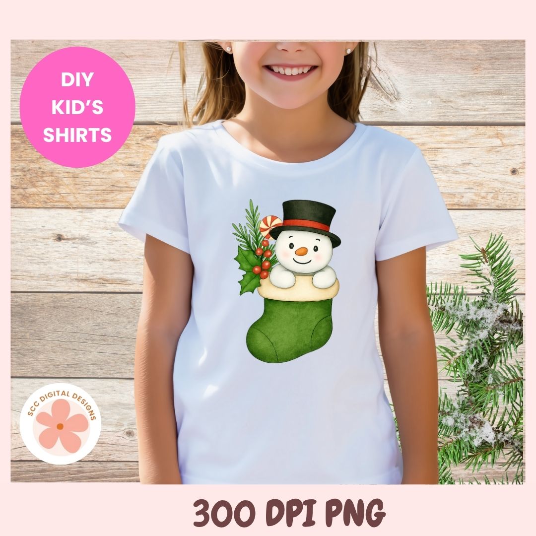 A child wearing a white short-sleeve t-shirt with a Christmas graphic of a snowman in a green stocking. The image has a pink border with text reading 'DIY KID'S SHIRTS' and '300 DPI PNG'.