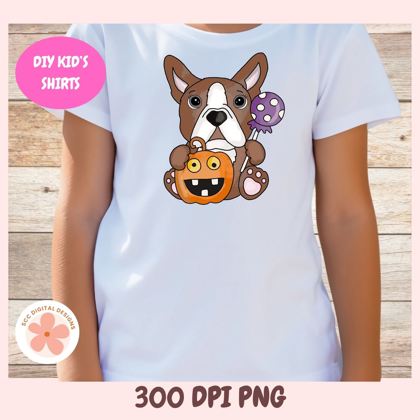A child wearing a white short-sleeve T-shirt with a cartoon French bulldog graphic holding an orange pumpkin and a purple lollipop. The photo is cropped from the neck down against a light wood plank background, with pink border graphics reading 'DIY KID'S SHIRTS' and '300 DPI PNG'.