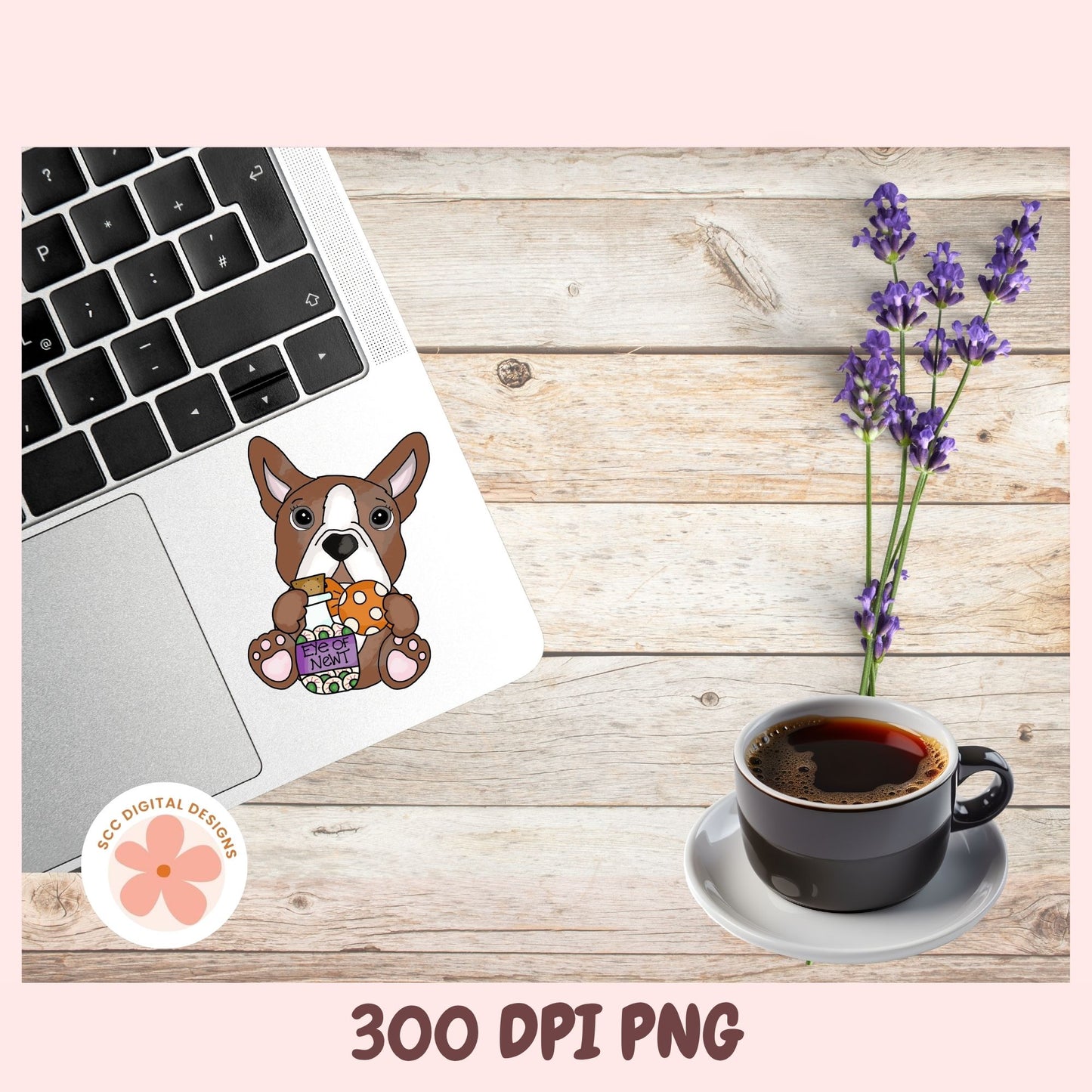 A digital mockup showing a cute cartoon French Bulldog sticker holding a basket of flowers, applied to the back of a silver laptop. The scene is styled on a light wood background alongside a cup of coffee, lavender flowers, and a circular logo for 'SEO Digital Designs'.