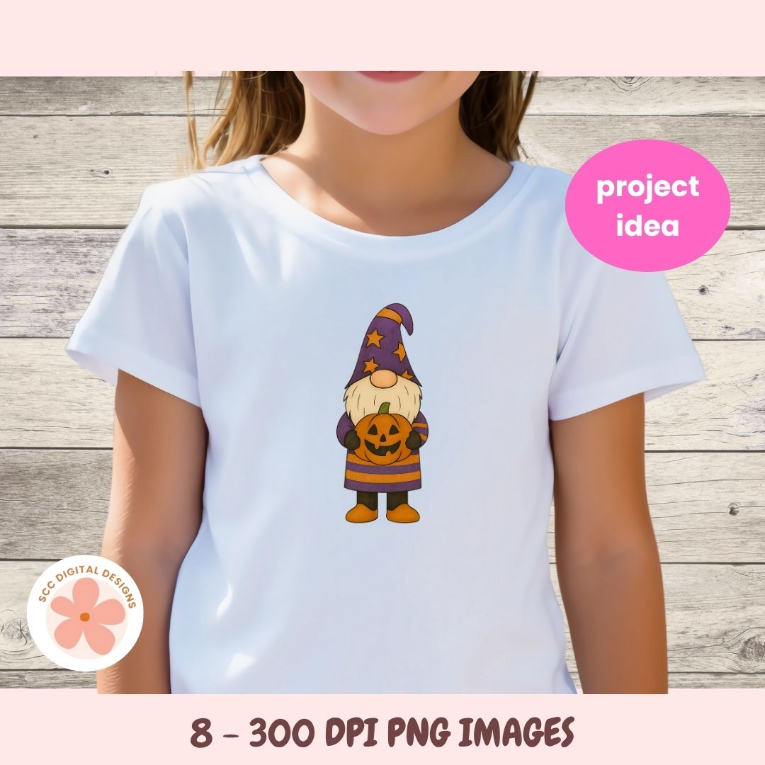 White t-shirt with a Halloween-themed gnome graphic on a wooden background