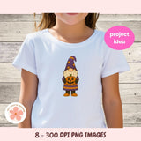 White t-shirt with a Halloween-themed gnome graphic on a wooden background